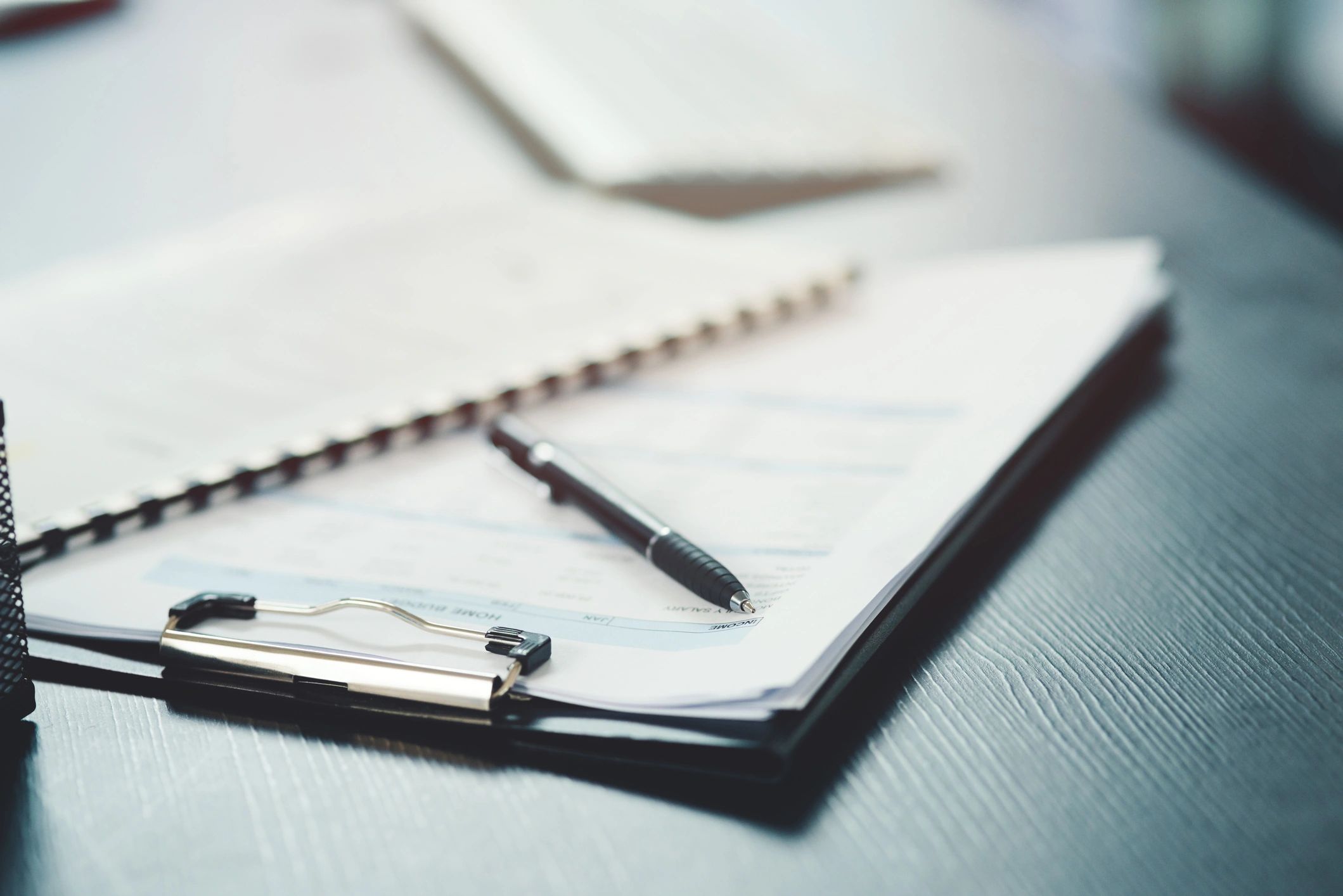 Organized legal documents and notebook on an office desk